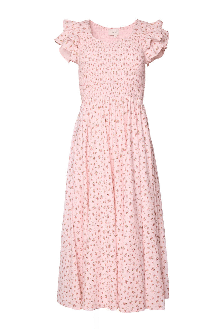 The Hattie Dress in Madeline Pink by Ivy City Co is a light pink midi cotton dress with short sleeves, ruffled shoulder detail, floral print, a fitted smocked bodice, and flowy gathered skirt—ideal as a birthday girl dress.