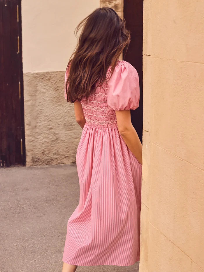 Red stripe midi dress with shirred bodice, puff sleeves, frill neckline and flowing skirt.