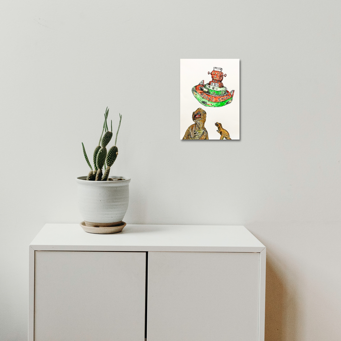 The artwork 'Space Robot V Dinosaurs rd 2 (orange)' by Andrew Chan features a whimsical illustration in ink and watercolor showing a red mechanical robot atop a vibrant green platform confronting two dinosaur figures below. The composition balances playful sci-fi elements with prehistoric creatures in a 12x9 inch format, using bold orange and green hues.