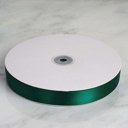 Green satin ribbon spool on white background #whtbkgd