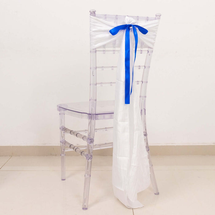 Clear acrylic chair with white and blue ribbon decoration