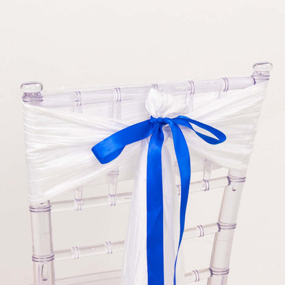 Clear chair with white and blue decorative sash