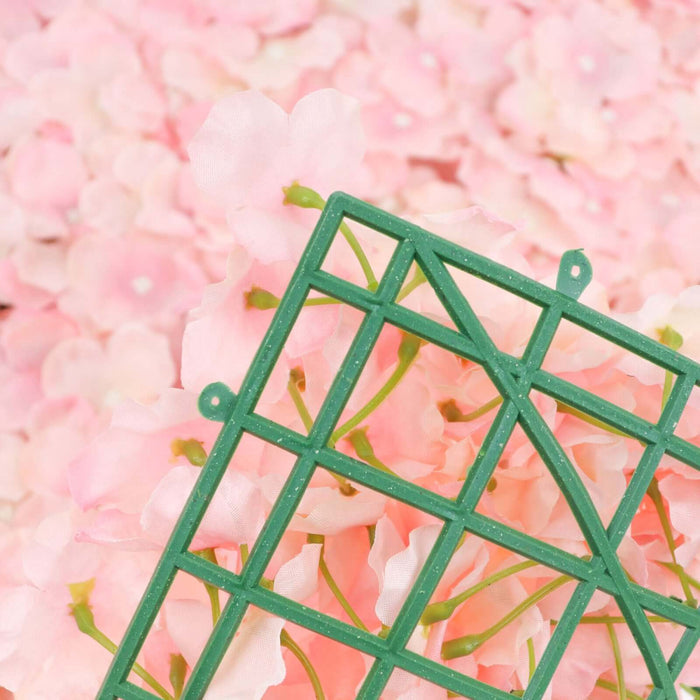 Green floral grid against a backdrop of soft pink flowers.