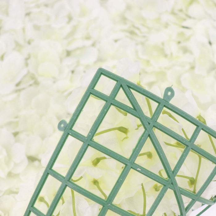 Green floral foam grid on a bed of soft white flowers