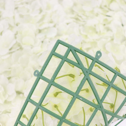 Green floral foam grid on a bed of soft white flowers