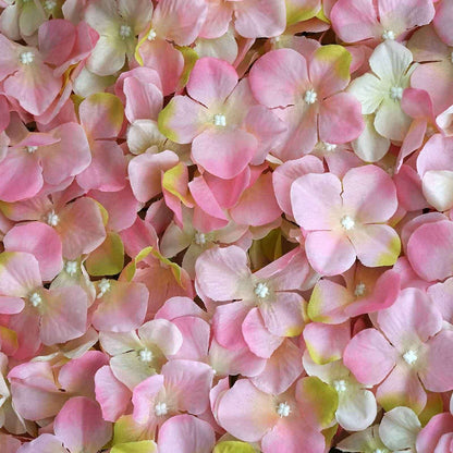 Pink and white artificial flower petals arranged in a vibrant pattern.