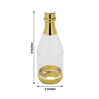 Clear glass bottle with gold accents, 6 inches tall and 2 inches wide.