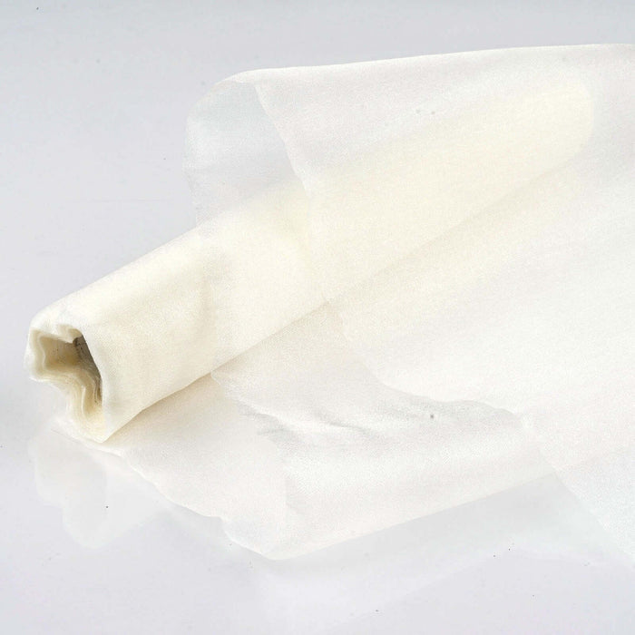 Sheer white fabric roll on a plain background