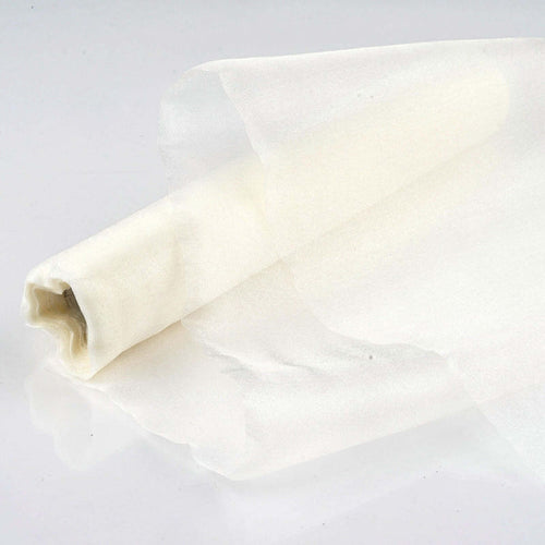 Sheer white fabric roll on a plain background