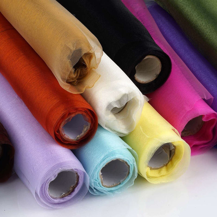 Colorful rolls of fabric arranged in a vibrant display.