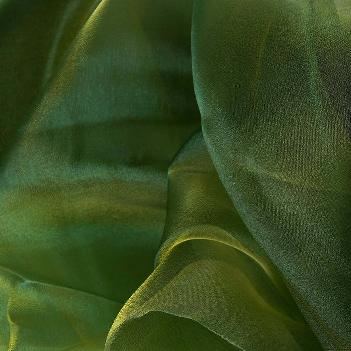 Soft green chiffon fabric texture with flowing drapes. #whtbkgd