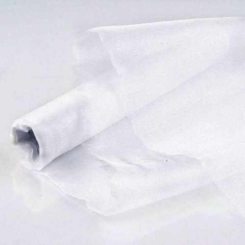 Sheer white fabric roll on a plain backdrop.