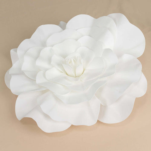 White decorative flower wall art in a layered petal design.