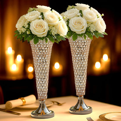 Elegant crystal vases with white roses, perfect for weddings or special occasions.