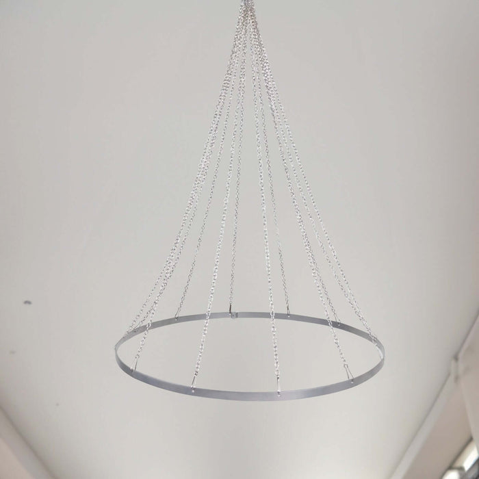 Modern silver chandelier with sleek design and hanging chains