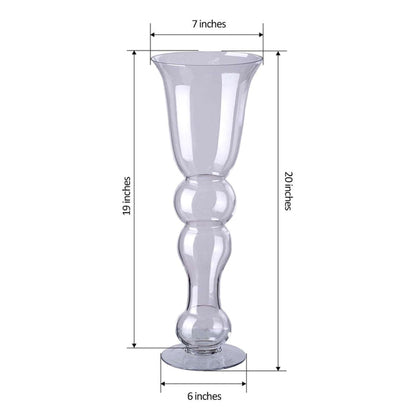 Clear glass vase with a decorative shape, 20 inches tall, 7 inches wide.
