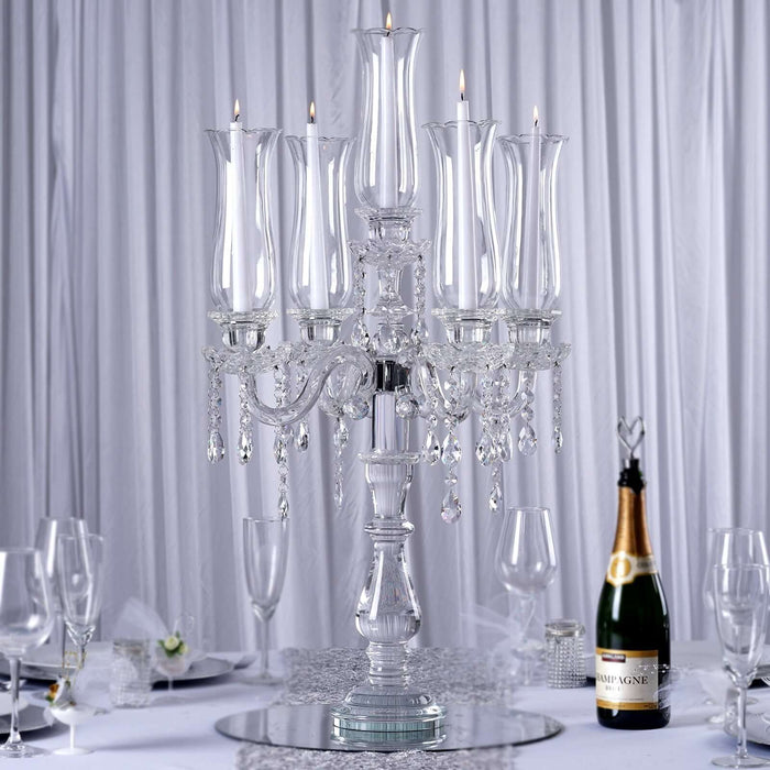 Elegant crystal candelabra with multiple candle holders and hanging crystals