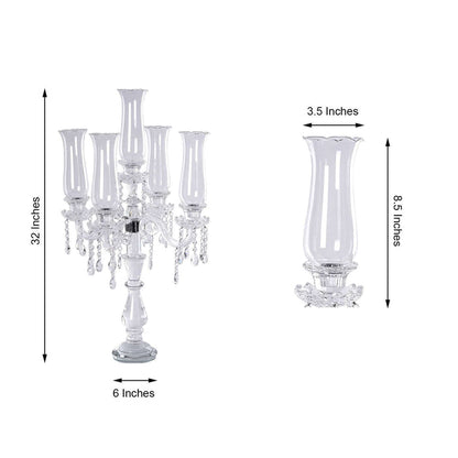 Elegant crystal candelabra with five glass candle holders, 32 inches tall.