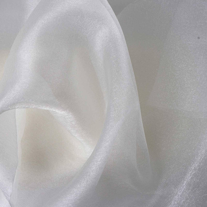 Sheer white fabric with a smooth texture, elegantly draped.