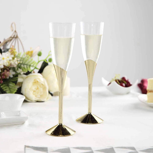Elegant champagne flutes with gold accents on a table setting.