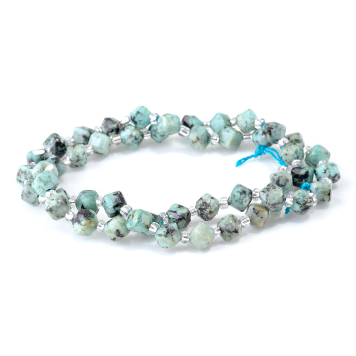 This is a Dakota Stones 4x6mm African Turquoise Corner Gemstone strand with table-cut cube beads in 15-16 inch strand.