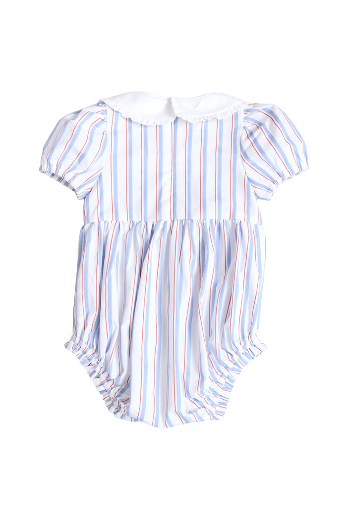 The Ivy City Co Baby Emery Romper in Heritage Stripe features short puff sleeves, a white Peter Pan collar, and red, blue, and white stripes—perfect for a cheerful Fourth of July. Pictured on a white background.