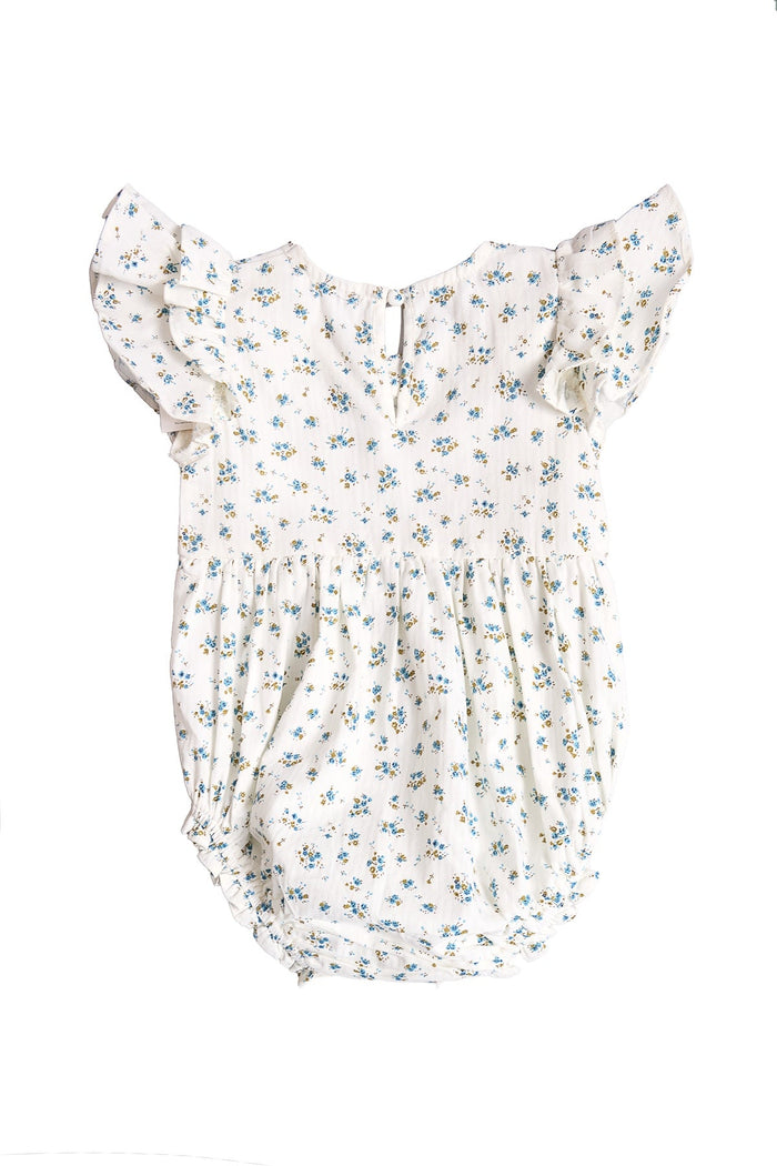 The Baby Hattie Romper in Madeline Blue by Ivy City Co features short ruffled sleeves and a delicate blue floral pattern, crafted from soft cotton for comfort—perfect as a special occasion baby outfit, shown on a plain white background.