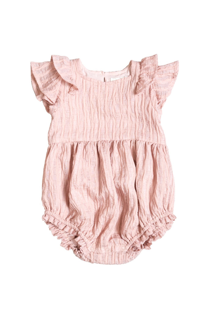 The Baby Hattie Romper in Pink Stripes by Ivy City Co features ruffled short sleeves, a gathered waist, and elastic leg openings. Crafted from textured fabric with subtle pink stripes, this light pink romper is ideal for Mom and Me matching moments. Displayed on a white background.