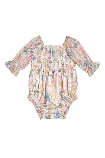 The Baby Madeline Romper in Cordelia Floral by Ivy City Co features a square neckline, smocked bodice, ruffled cuffs, and a pastel pink, yellow, and blue floral print—perfect for sweet mommy-and-me moments.