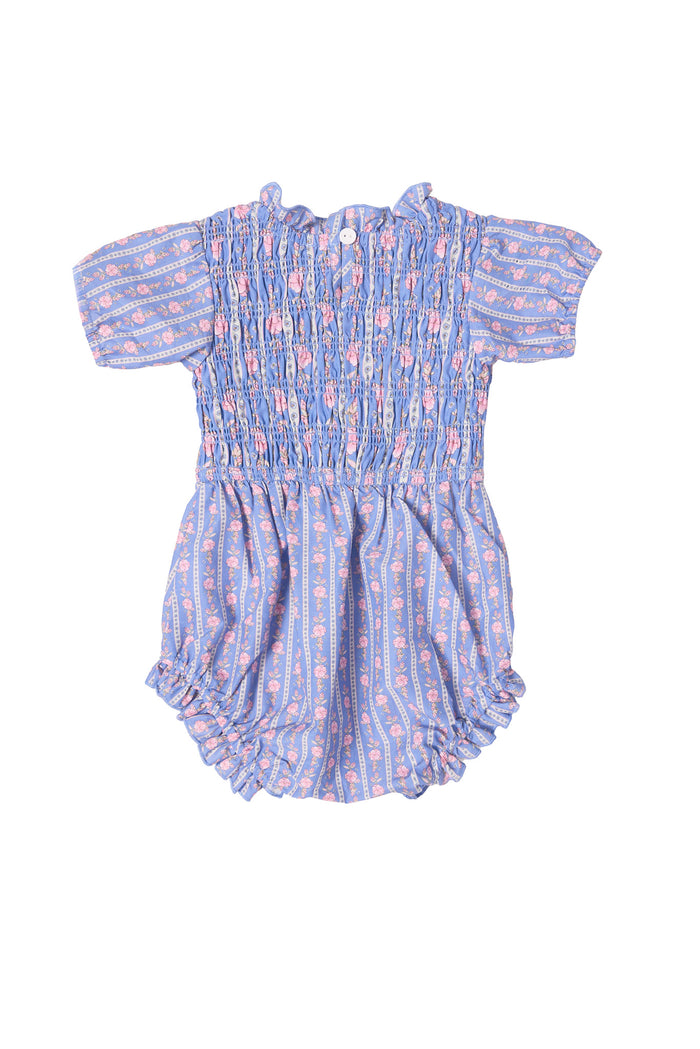 The Ivy City Co Baby Mariah Romper in Linear Print is a short-sleeved romper with smocked detailing, pink floral pattern, button-back closure, and elastic leg openings for comfort.