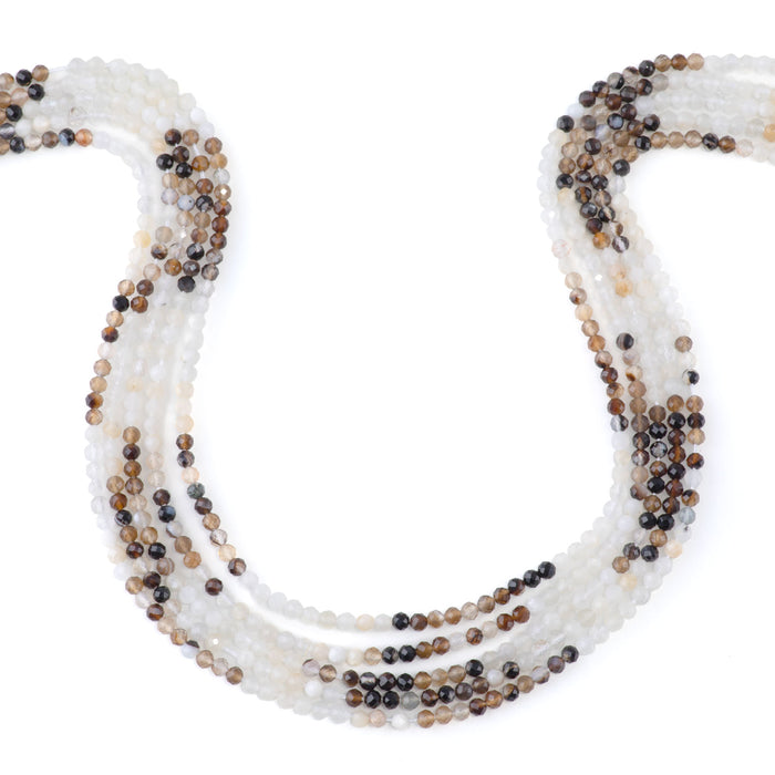 This is a Dakota Stones 3mm Banded Mixed Stone Brown White Gemstone strand with faceted round beads in 15-16 inch strand.