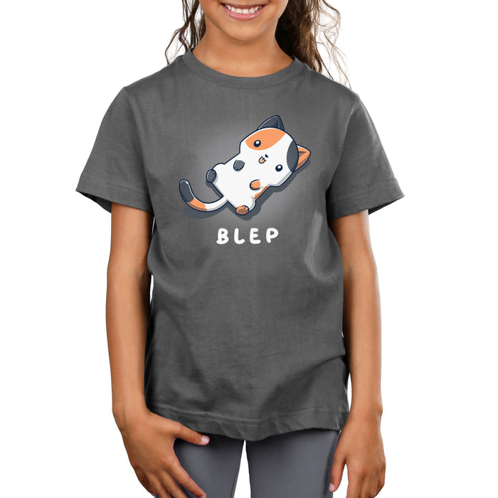 Premium Cotton T-shirt_TeeTurtle charcoal gray Blep Kitty apparel featuring an illustration of a calico cat laying on its back with its tongue sticking out. The word "BLEP" is written below.