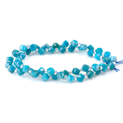 This is a Dakota Stones 4x6mm Blue Apatite Corner Gemstone strand with table-cut cube beads in 15-16 inch strand.