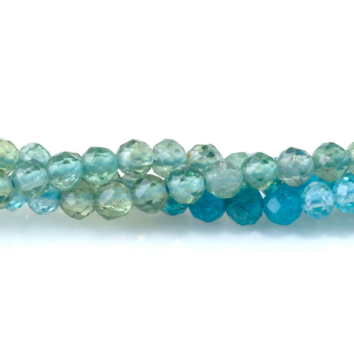This is a Dakota Stones 3mm Blue Green Apatite Banded Gemstone strand with faceted round beads in 15-16 inch strand.