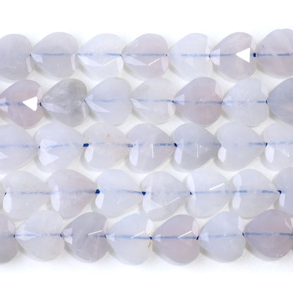 This is a Dakota Stones 14mm Rose Quartz Gemstone strand with faceted heart beads in 15-16 inch strand.