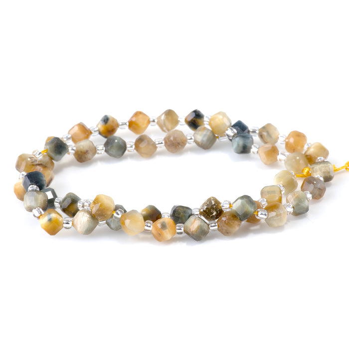 This is a Dakota Stones 4x6mm Blue Tiger Eye Corner Gemstone strand with table-cut cube beads in 15-16 inch strand.