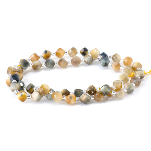This is a Dakota Stones 4x6mm Blue Tiger Eye Corner Gemstone strand with table-cut cube beads in 15-16 inch strand.
