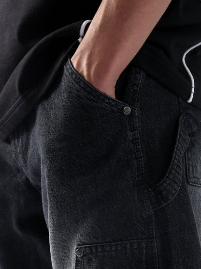 Carpenter washed black denim male model side view full body Pakistan – GROOVY