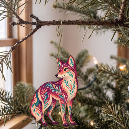 Laser-cut maple wood Coyote folk art ornament O252 hanging on a fir branch, made in USA