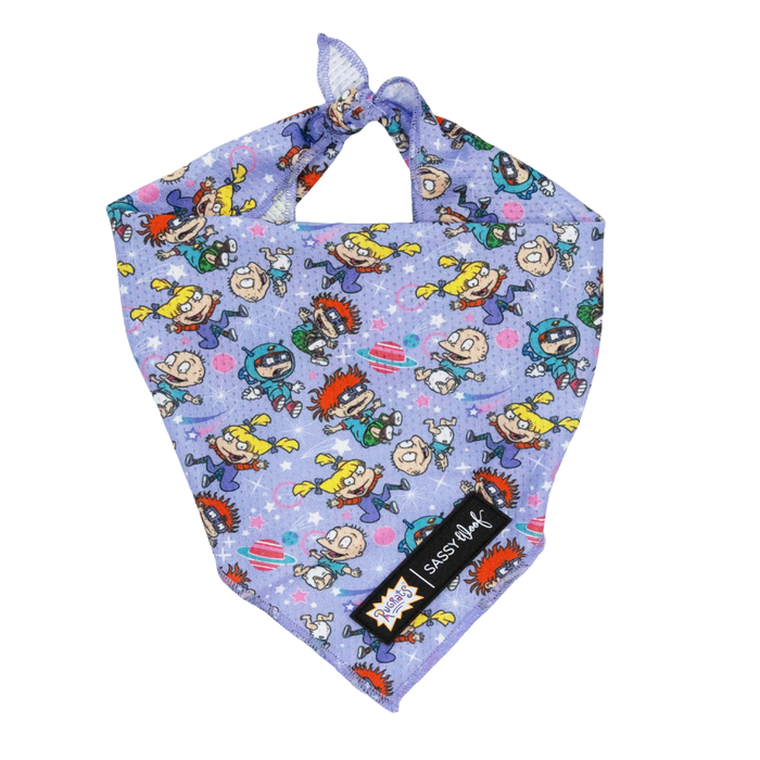 The Sassy Woof Dog Bandana - Nickelodeon Rugrats™ is a purple bandana featuring colorful Rugrats characters and a black Sassy Woof tag—perfect for fans of playful Nickelodeon dog accessories!.