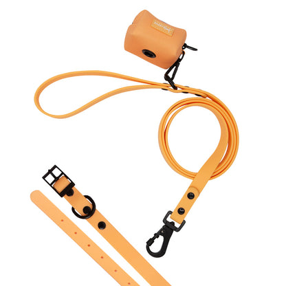 The Sassy Woof Dog Bundle - Adventure Collection (Orange) features a waterproof leash, durable collar with black hardware, and matching waste bag holder, all displayed on a white background.