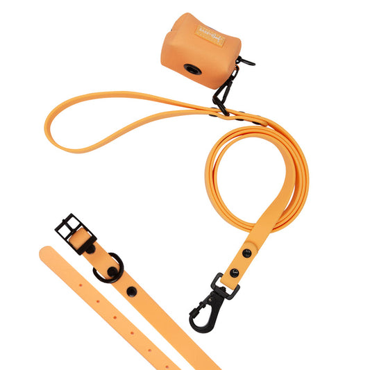 The Sassy Woof Dog Bundle - Adventure Collection (Orange) features a waterproof leash, durable collar with black hardware, and matching waste bag holder, all displayed on a white background.
