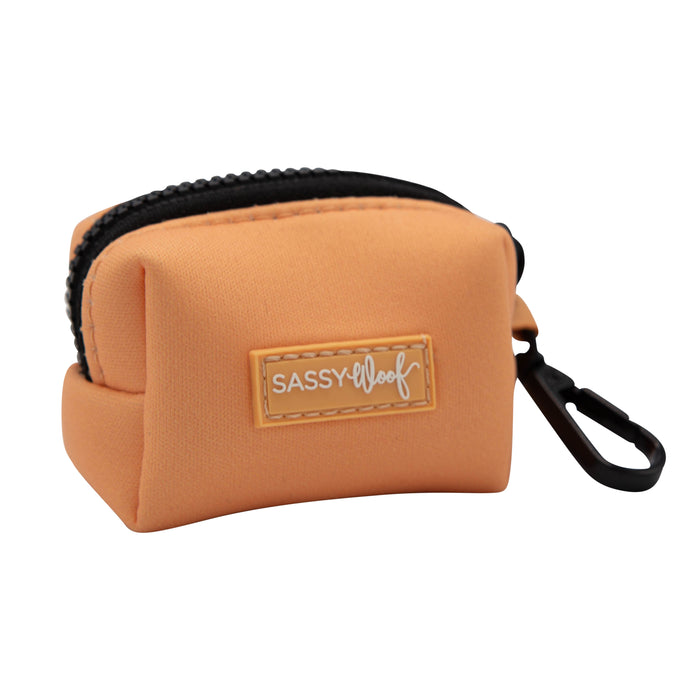 The Sassy Woof Dog Bundle - Adventure Collection (Orange) includes a soft orange pouch with zipper, black clip, and stitched logo—ideal for treats or waste bags—perfect to pair with any durable collar for your adventure-ready pup.