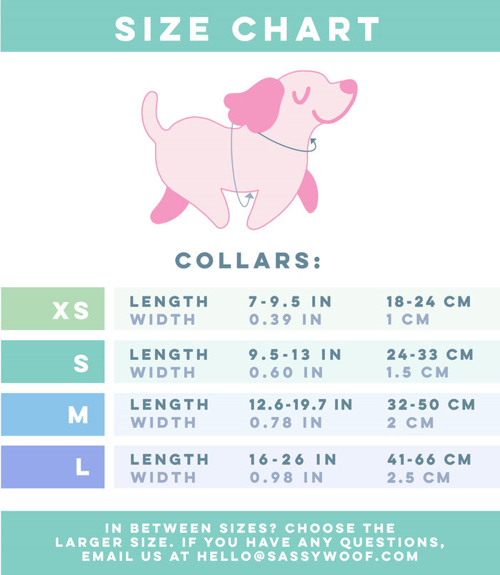 Size chart for the Sassy Woof Dog Collar - BARBIE™ On a Roll, showing four sizes (XS to L) with pink cartoon dog. Each size lists collar length and width in inches/cm. XS is smallest, L largest. Contact info provided below.