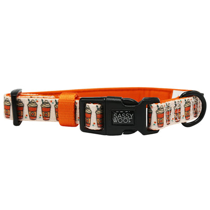 The Sassy Woof Dog Collar - Pie There! features an orange and white design with a pie pattern, adjustable fit, soft neoprene lining, black plastic buckle, and sturdy D-ring for leash attachment.