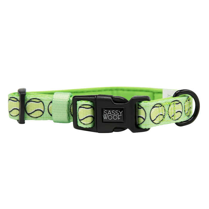 The Sassy Woof "Serving Up Sass" dog collar features a green tennis ball pattern, soft neoprene lining, sturdy metal D-ring, and a black plastic buckle for comfort and style.