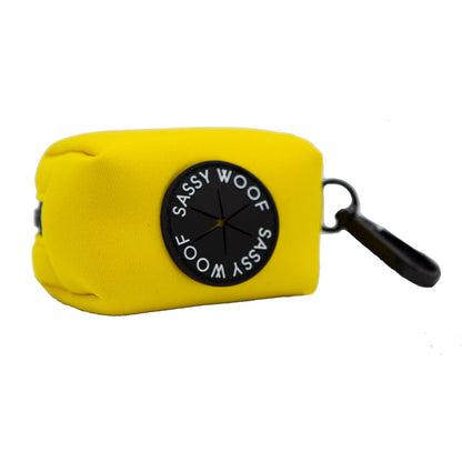 A vibrant neon yellow pouch featuring the signature black circular Sassy Woof logo and a black clip, designed for carrying essentials like dog waste bags—perfectly complementing your Dog Collar Three Piece Bundle - Neon Yellow from Sassy Woof or other matching neon yellow dog accessories.