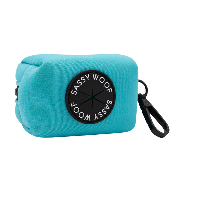 The Sassy Woof Dog Four Piece Bundle in Neon Blue features a blue pouch with a black circle—ideal for carrying treats while following your puppy’s growth plan or on walks with its neon harness.