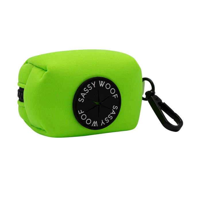 The Sassy Woof Dog Four Piece Bundle in Neon Green features a bright green rectangular pouch with a black clip and Sassy Woof patch—ideal for pairing with your dog's neon green harness on daily walks.