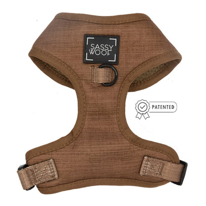 The Sassy Woof Dog Four Piece Bundle - Teddy features a brown adjustable harness with black trim, SASSY WOOF label, black metal ring, and patented icon on the right.